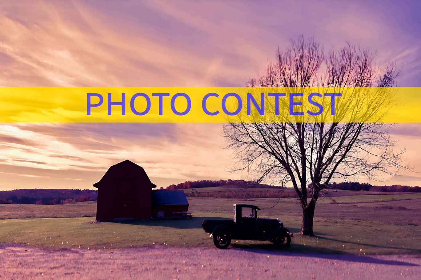 a photo of a barn with an antique truck